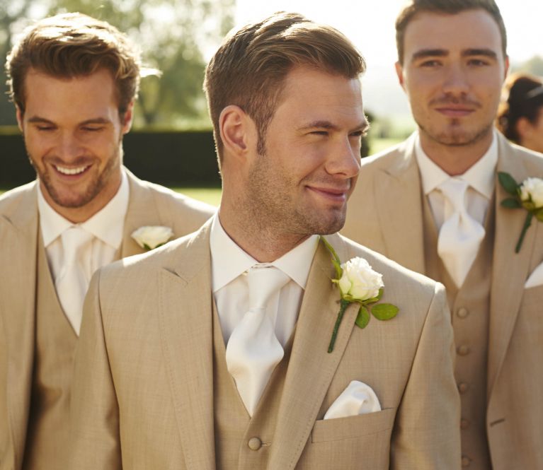 A group of men in wedding suits