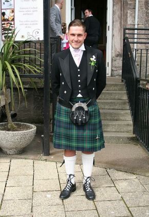 Child in a kilt and highland dress wear